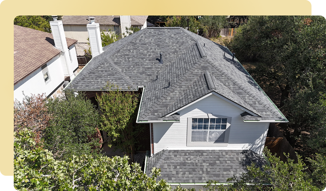 Grey Class 4 impact-resistant roof on a two-story Austin home completed by Impact Resistant Roofing + Renovation