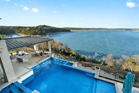 roof replacement Lakeway with poolside lake views