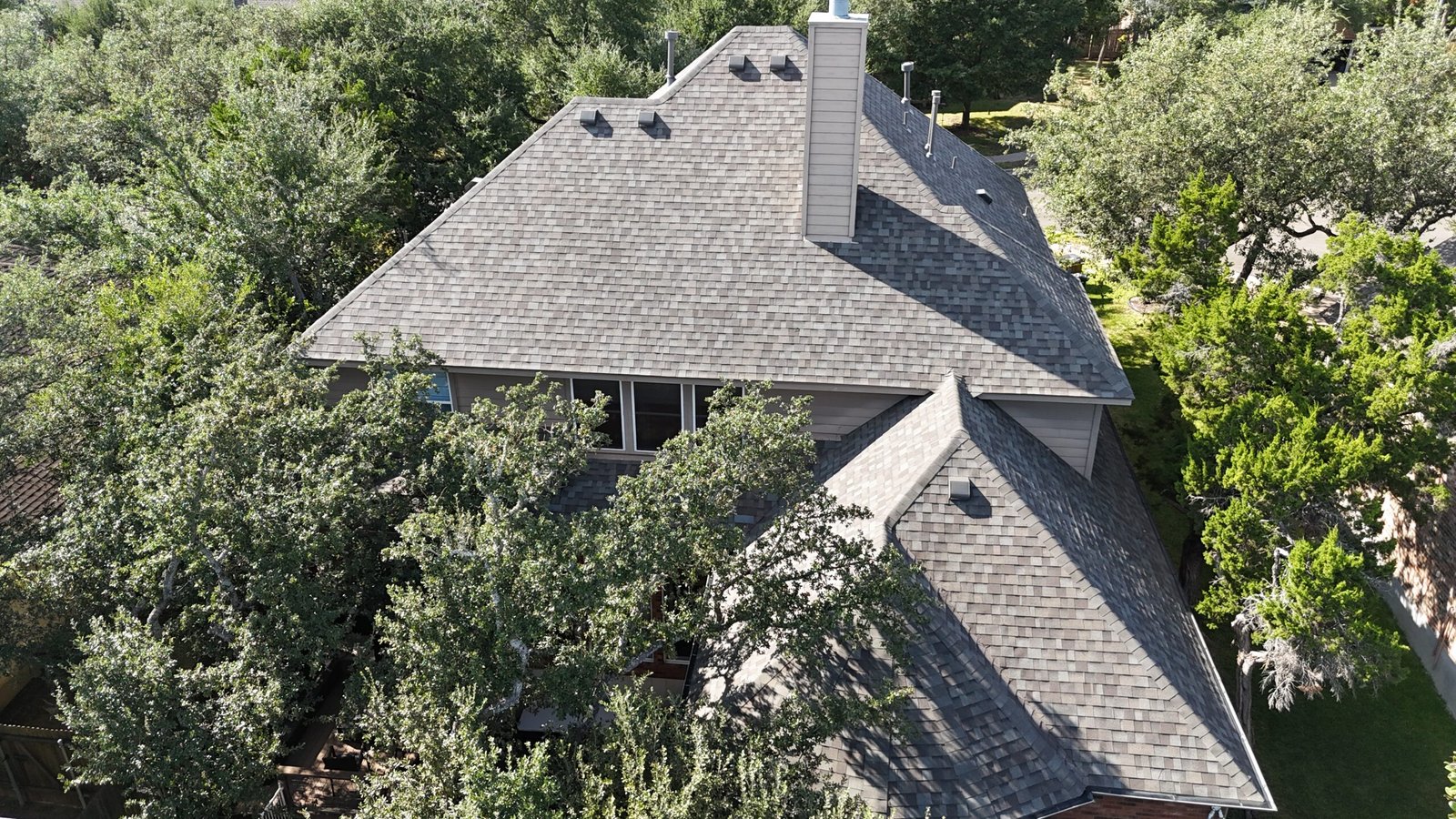 Roof Replacement Round Rock brick two story home